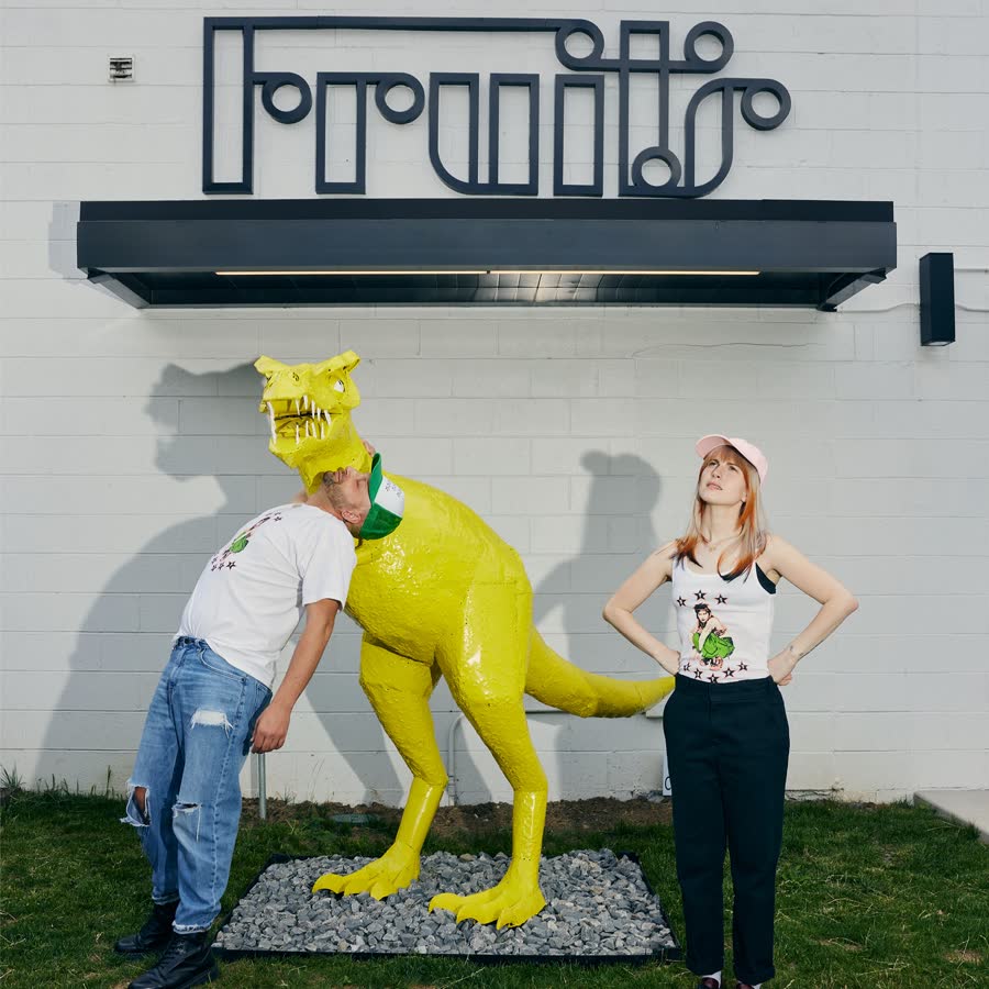 The Fruits Hair Lab storefront in Nashville, with its yellow dinosaur statue