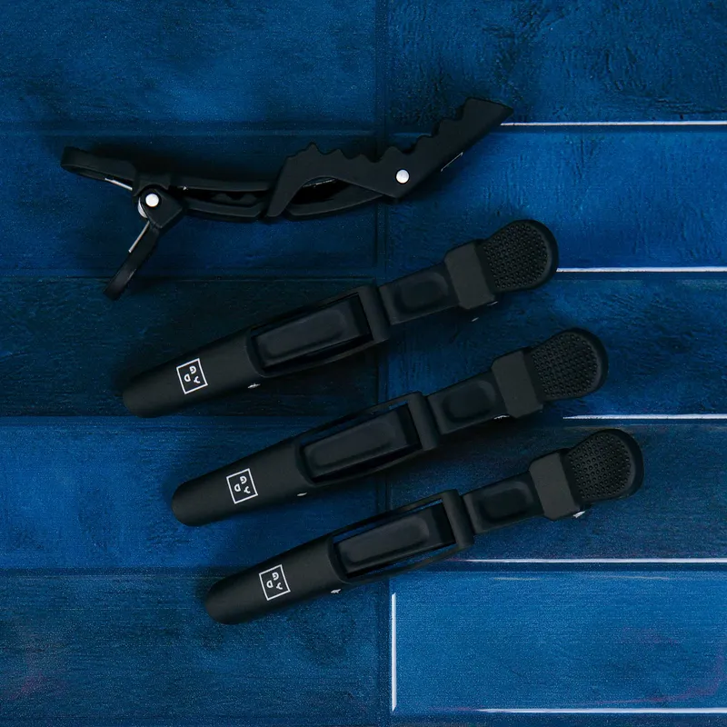 Black Good Dye Young grip clips on blue tile