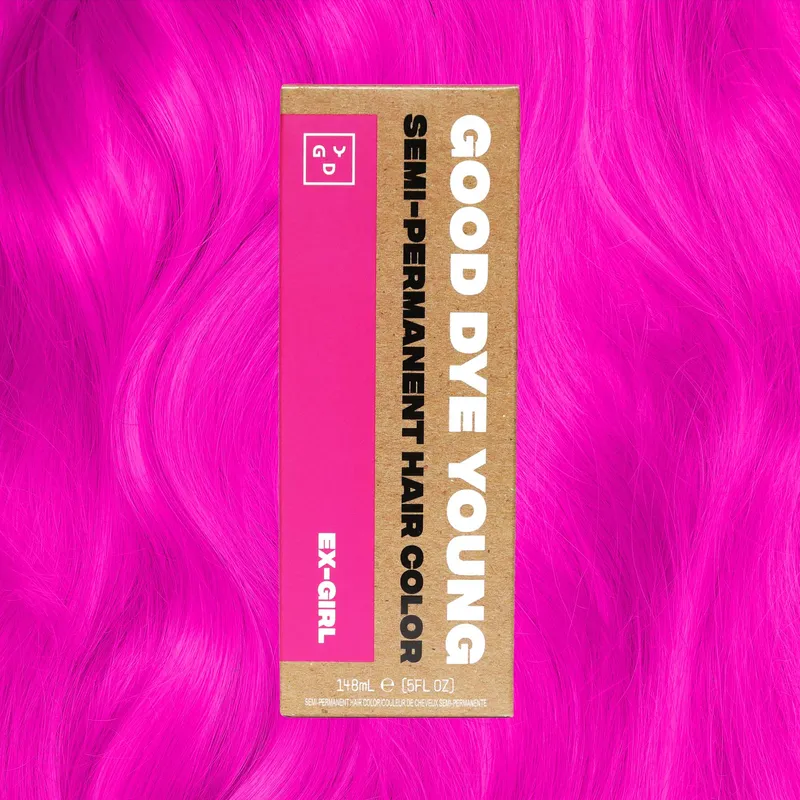 A jar of Ex-Girl semi-permanent color on hot pink hair